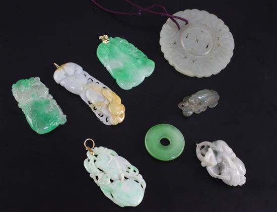 Seven Chinese jadeite pendant carvings and a jade circular dish, 19th / 20th century, the largest 5cm